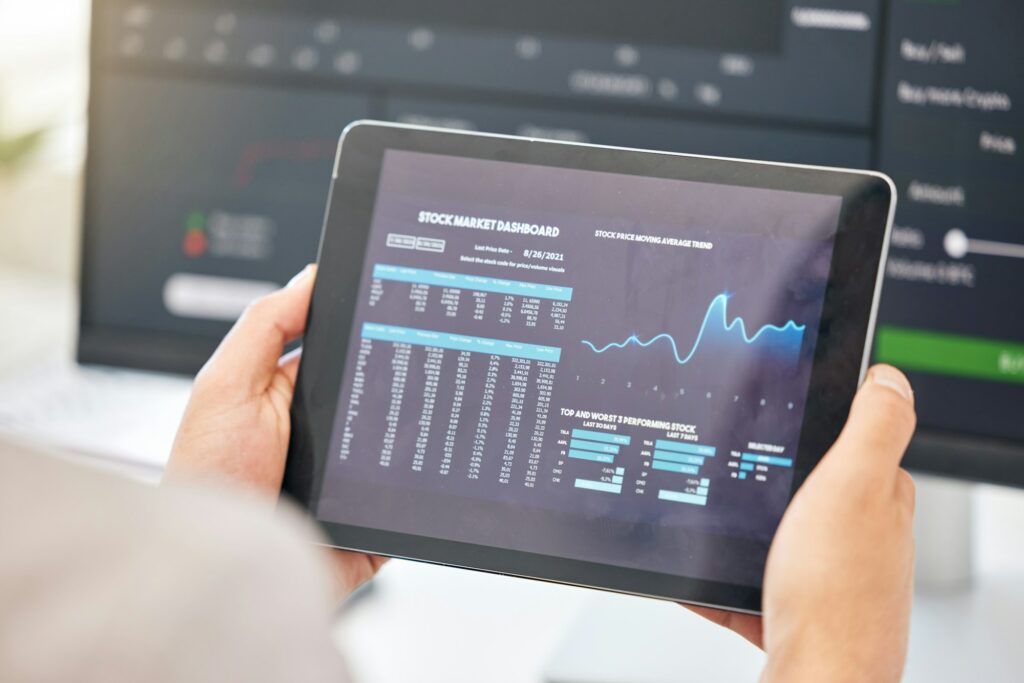 Tablet in hands, statistics and stock market with fintech and trading, invest and financial graph o